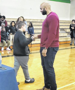 Former NFL player Hilee Taylor encourages students to read
