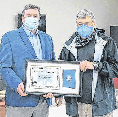 126461399_web1_Roy4
Courtesy photo
Doug Calhoun, central regional logistics specialist for NC-OEMS presented Hammond with a plaque congratulating him on his service and his retirement.
