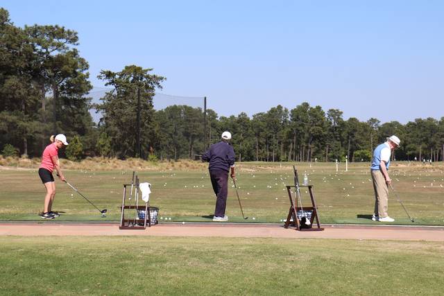 Golfers hit balls on the practice range at Pinehurst Resort.
Neel Madhavan | Daily Journal