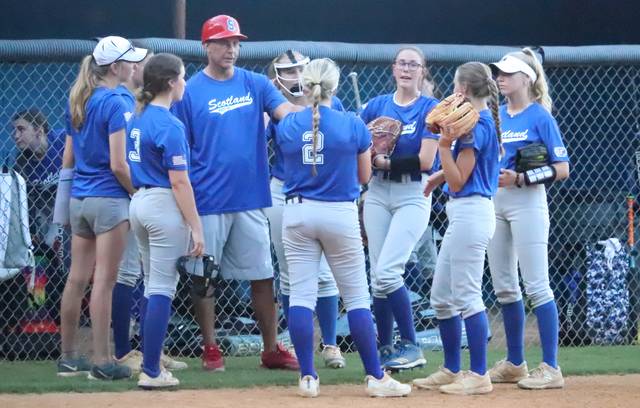 Scotland Post 50 gathers to talk things over in between innings during a game against Robeson Post 5 earlier this season.
                                 Neel Madhavan | Laurinburg Exchange