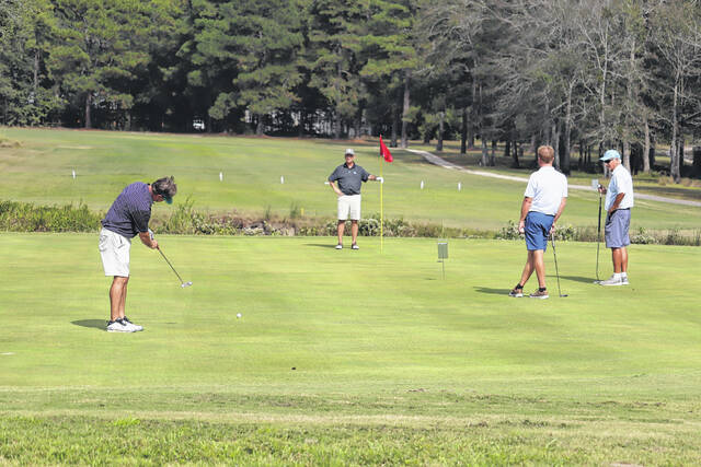 <p>A group finishes off the front-nine on the 10th green at Scotch Meadows Wednesday.</p>
<p>Neel Madhavan | Laurinburg Exchange</p>