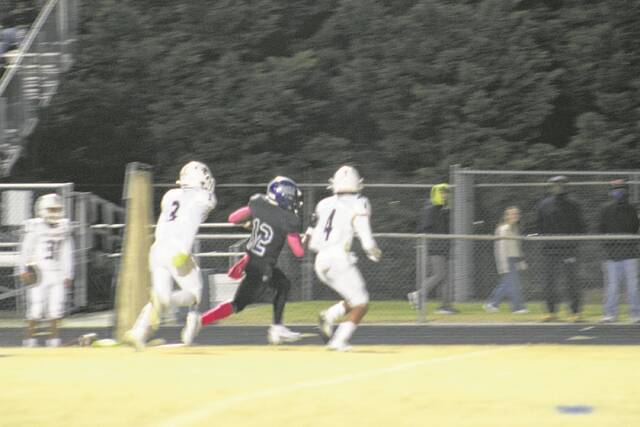 129012933_web1_4
Scots running back Zay Jones (12) runs down the sideline for one of his three rushing touchdowns on the night. Jones finished with 309 rushing yards, which is tied for the most since former Scotland quarterback Warren Bell ran for 309 rushing yards against Hoggard in the 2017 regional final game.
Photos| Brandon Hodge/ The Laurinburg Exchange