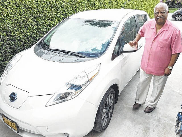129142248_web1_John-Felder
Hamlet-native John Felder stands next to a Nissan Leaf at his dealership.
Photo courtesy of the Cayman Compass