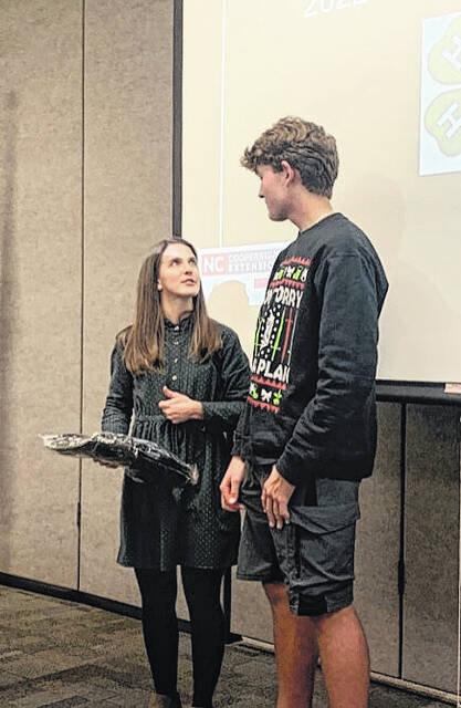 Catherine Shelley presents 4-Her of the year to Gavin Applewhite.
                                 Photo courtesy of Catherine Shelley