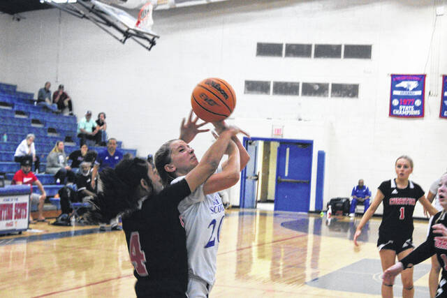 Lady Scots guard Madison Dixon (20) is fouled by a Currituck County player during Thursday nights second round playoff matchup.
                                 Photos| Brandon Hodge/ The Laurinburg Exchange