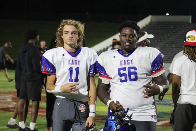 129836941_web1_IMG_2402
Cadyn Graves, left, and Amari Chance, right, take a picture on the field together after Wednesdays East-West All-Star Football Game at Grimsley High Schools Bob Jamieson Stadium in Greensboro.
Brandon Hodge | The Laurinburg Exchange