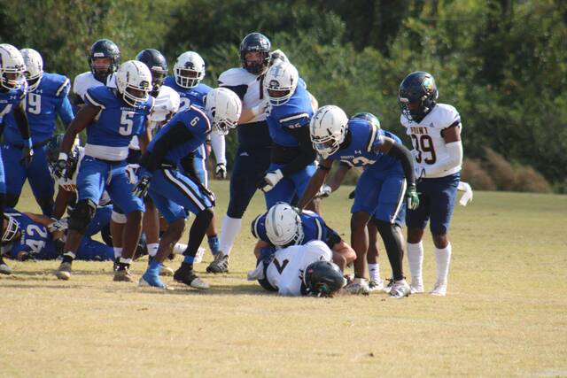 129854355_web1_IMG_6841
A Knights defender tackles Point running back Shiloh Addo-Nobles (7) during a game played on Nov. 12, 2022.
File photo