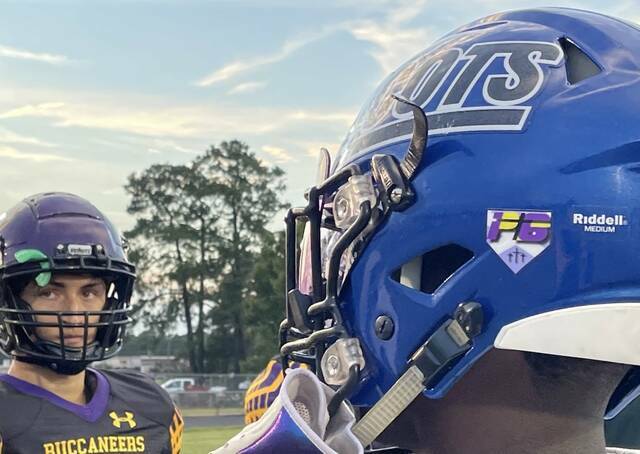 129954462_web1_128876730_web1_thumbnail_Image--61-
A Scotland captain and a Jack Britt captain stand at the center of the field before a game on Sep. 9, 2022.
File photo