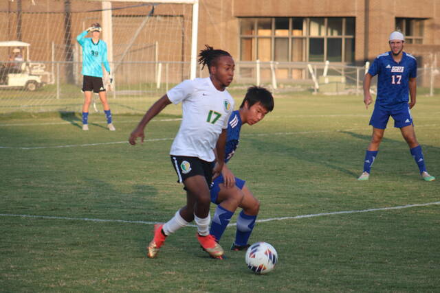 <p>Scotland’s Ricky Zhang (5) tries to take the ball from Richmond’s Vernan McDonald (17) during Monday’s game in Laurinburg.</p>
<p>Brandon Hodge | The Laurinburg Exchange</p>
