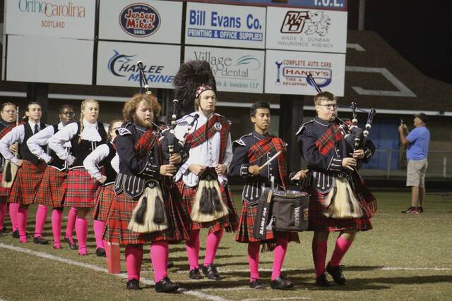 The Fighting Scots marching band takes the field for the national anthem before Friday nights game against Pinecrest at Pate Stadium in Laurinburg.
                                 Brandon Hodge | The Laurinburg Exchange