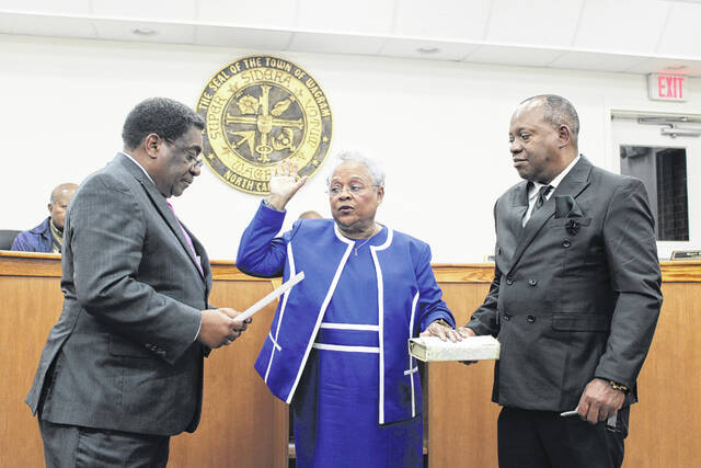 130206478_web1_Pierce_1
Rep. Garland Pierce administers the Oath of Office of the mayor of Wagram to his wife Barbara Pierce on Thursday.