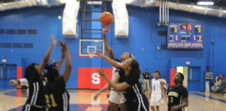 
			
				                                Scotland’s Alicia McClain (with ball) puts up a floater over several Marlboro County players during Saturday’s Battle of the Border rivalry game in Laurinburg.
                                 Brandon Hodge | The Laurinburg Exchange

			
		