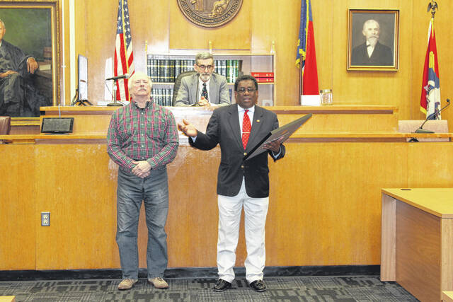 130235784_web1_IMG_1551
Rep. Garland Pierce presents John B. Blue with the Order of the Long Leaf Pine at the Scotland County Courthouse with the honorable Judge Stephan Futrell presiding. Blue has served as a magistrate at the courthouse for 42 years.
Tomeka Sinclair | The Laurinburg Exchange