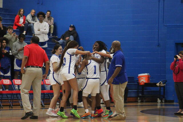 130301602_web1_IMG_7673
The Scotland womens basketball team celebrates with Morgan Thompson (1) after she reached the 1,000 career-point mark with 5:09 to go in the second quarter of Tuesdays game against Pinecrest in Laurinburg.
Brandon Hodge | The Laurinburg Exchange