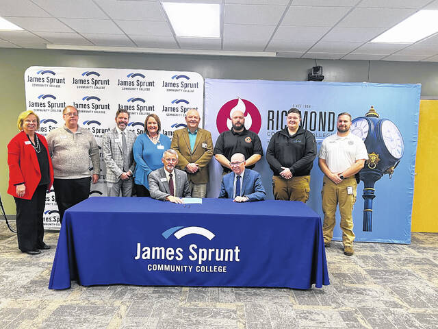 130338349_web1_JSCC_RCC-Signing
Dale McInnis, president of Richmond Community College, and Jay Carraway, president of James Sprunt Community College, signed an agreement last week that will allow JSCC students to enroll in the online program and complete an associate degree in 911 Communications & Operations.
Courtesy photo