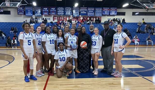 130341660_web1_IMG_3735
Scotlands Morgan Thompson (1) is recognized before Tuesdays home game against Southern Lee for reaching 1,000 career points on Jan. 16 against Pinecrest. Thompson is surrounded by teammates, coaches, administration and family.
Contributed by Zach McNeil