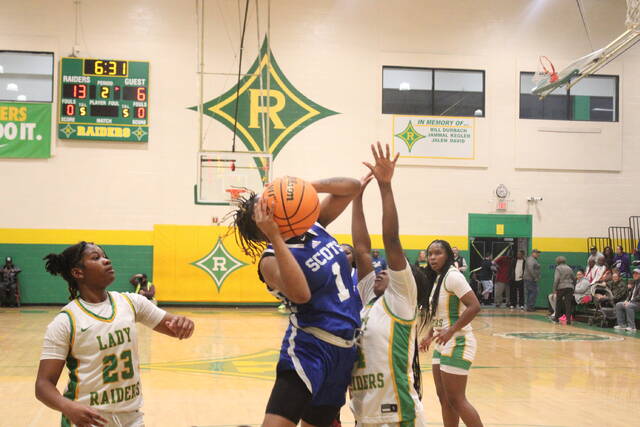 Scotlands Morgan Thompson (1) goes up for a shot over Richmonds Jasiah Gilchrist (4) during Fridays game in Rockingham.
Brandon Hodge | The Laurinburg Exchange