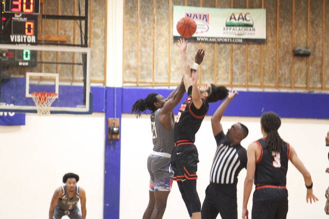 <p>St. Andrews’ Quwan Barnes (21) and Union’s Anton Mozga (23) jump for the opening tip to begin Saturday’s game on Harris Court in Laurinburg.</p>
<p>Brandon Hodge | The Laurinburg Exchange</p>