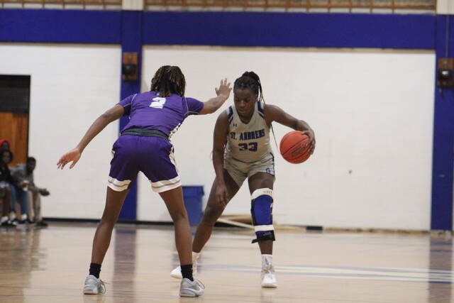 130419675_web1_IMG_7122
St. Andrews Ashley Starks (33) dribbles the ball as Columbias Lauren Wearbon (2) defends during a Dec. 2, 2023, game at Harris Court in Laurinburg.
File photo