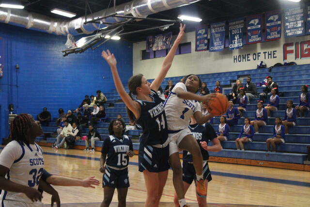 130446336_web1_130398543_web1_IMG_8415
Scotlands Morgan Thompson (1) attempts a shot over Union Pines Savannah McCaskill (14) during a Sandhills Athletic Conference tournament semifinal game on Feb. 21 in Laurinburg.
File photo