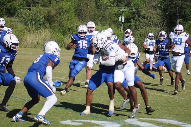 130532813_web1_IMG_9052
St. Andrews Will Gordon (14) gets tackled by a pair of defenders during Saturdays spring football game at Knights Field in Laurinburg.
Brandon Hodge | The Laurinburg Exchange