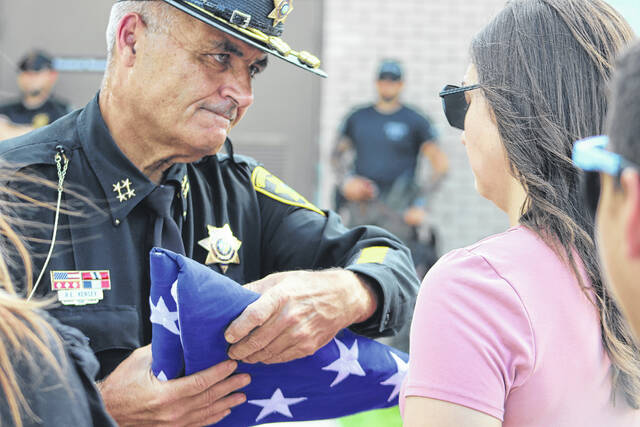 130750609_web1_IMG_2741
Scotland County Sheriff Ralph Kersey presents a flag during a memorial service held Wednesday for Deputy K-9 Bob, who passed away on June 6.
Tomeka Sinclair | The Laurinburg Exchange