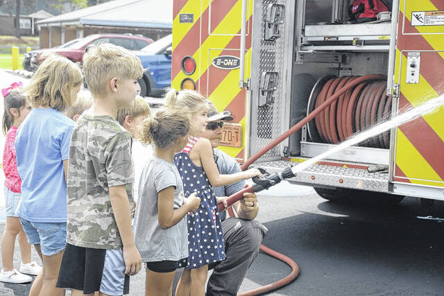 130787434_web1_IMG_3428
The Scotland County Memorial Library rounded out its programs this year at the Laurel Hill Community Center on Wednesday with the Laurel Hill Fire Department coming out to show the kids the fire truck and talk about fire safety. The library will be finishing out the summer reading program with a Princess and Pirate Tea Party this upcoming Wednesday at the library at 312 W Church St in Laurinburg. People can stop in anytime from 11 a.m. to 1 p.m. to participate in the activities.
Katelin Gandee | Scotland County Memorial Library