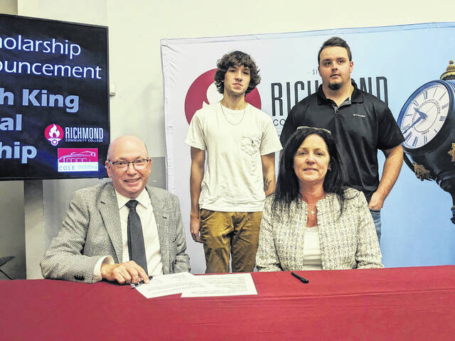 130865377_web1_Noah-King11
Dale McInnis, president of Richmond Community College, and Kristi King, mother of William Noah King, sign a scholarship in his memory while the two scholarship recipients, Tucker Freeman and Ryan Martin, look on.
Courtesy photo
