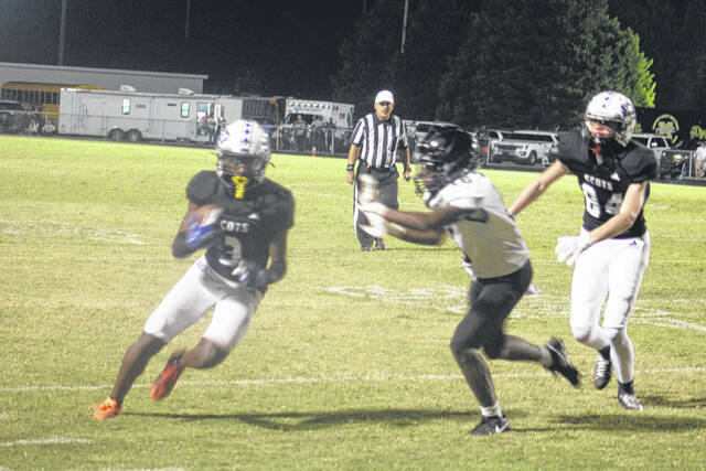 130713973_web1_IMG_0623
Dajuan Gibson makes a catch and runs by a Marlboro defender on Friday night at Pate Stadium. Gibson scored Scotlands first touchdown of the night on a punt return in the first quarter.
Andrew Smolar | The Laurinburg Exchange