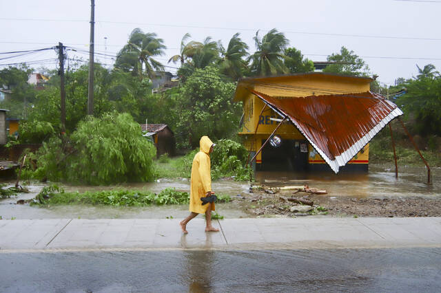 130939776_web1_130939776-101da92f6723438c8591122639042b4f
A person walks in the rain after the passing of Hurricane John in Marquelia, Mexico, Tuesday, Sept. 24, 2024. (AP Photo/Luis Alberto Cruz)