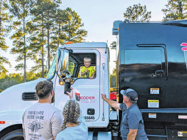 130943836_web1_Touch-a-Truck31
A child waves to his parents from the driver seat of a trash truck belonging to the Tedder Trash company at a previous Touch-A-Truck at Richmond Community College.
Courtesy photo | RichmondCC