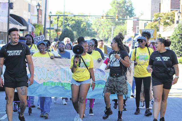 130949771_web1_UnityMarch_1
Dozens escorted by the Laurinburg Police Department participated in Long March for Unity and Justice Saturday, taking a 1.5-mile journey from the A.B. Gibson Center to I.E. Johnson Community Center, where the 32nd Annual Kuumba Festival was underway.
Photos by Tomeka Sinclair | The Laurinburg Exchange