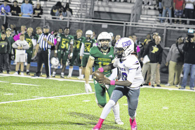 130997786_web1_IMG_1431
Quarterback JiSan McPhatter scrambles away from Tanner Corwin during Fridays showdown between Scotland and Pinecrest.
Andrew Smolar | The Laurinburg Exchange