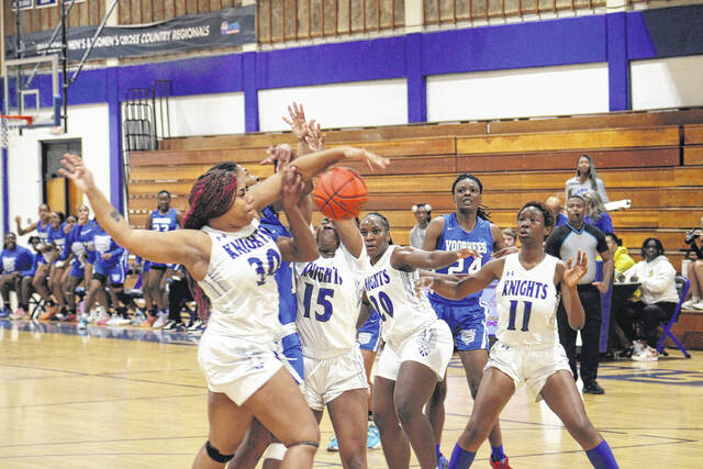 131037026_web1_IMG_1682
The Knights play tough defense on a Voorhees player driving to the basket during their home opener on Saturday.
Andrew Smolar | The Laurinburg Exchange