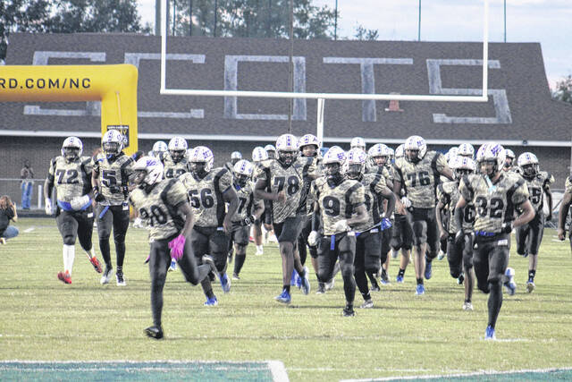 131049774_web1_IMG_0982
The Fighting Scots finished their 5-5 regular season in Richmond last week and now await their playoff fate until seeding day on Sunday. Here, the team runs onto the field prior to a home game against Hoke County earlier this season.
File Photo