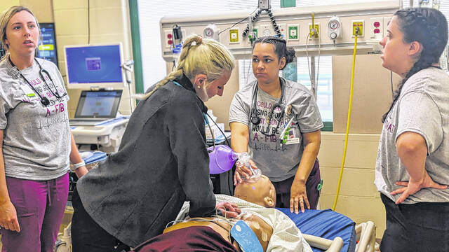 131114301_web1_ADN-Mock-Disaster
Richmond Community College students in the Associate Degree Nursing program train with a high-fidelity mannequin in the Simulation Learning Laboratory.
Wylie Bell | RichmondCC