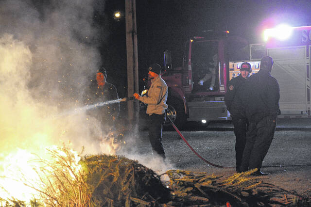 131194962_web1_Bonfire
On Friday, a crowd gathered at Legion Park to witness around 45 Christmas trees go up in flames during the annual Christmas Tree Bonfire hosted by the City of Laurinburg Fire Department. Despite the cold, attendees enjoyed the event, and some roasted marshmallows were provided by firefighters on smaller fires.
Katelin Gandee | The Laurinburg Exchange