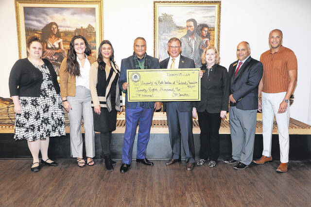 131212722_web1_Check-endowment
Last month, Julian Pierce Memorial Scholarship committee members presented a $28,000 contribution to The University of North Carolina at Pembroke. Shown are Devin Trego, far left, Eleni Garbrandt, Dr. Rebekah Lowry, Harvey Godwin Jr., Chancellor Robin Gary Cummings, M.D., Anita Stallings, Kelvin Jacobs and Patrick Stricklan.
Courtesy photo | UNCP