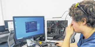 
			
				                                A student in Richmond Community College’s cybersecurity program works on a lesson involving computer hardware.
 
			
		