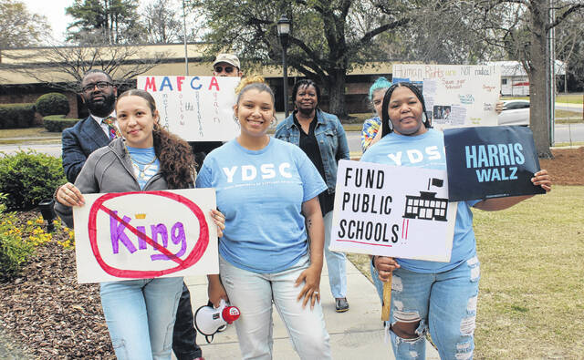 131381884_web1_IMG_4221
The Young Democrats of Scotland County were among a group protesting outside of the opening of Congressman Mark Harris’ new district office at Laurinburg City Hall.
Tomeka Sinclair | The Laurinburg Exchange