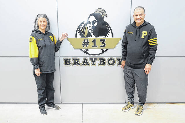 131430966_web1_inside-brayboy-2
Ray Brayboy, right, and his wife Bea Brayboy, left, pose with his retired jersey after a ceremony Saturday at UNC Pembroke.
UNCP Athletics
