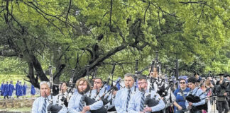 
			
				                                For the last time, the sonorous skirl of the bagpipes accompanied graduates as they traversed the causeway across the lake during St. Andrews University’s final graduation ceremony held Sunday.
                                 Stephanie Walcott | The Laurinburg Exchange

			
		