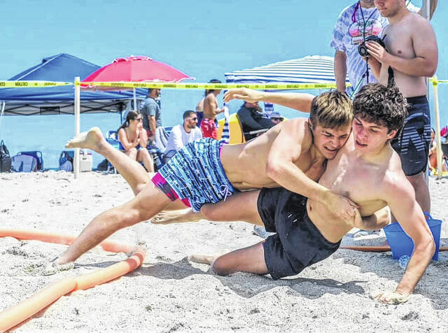 131496157_web1_1000007187
David Coptsias, a former wrestler at St. Andrews fought his way to victory scoring a first-place finish in the Beach Wrestling World Team Qualifiers held at Carolina Beach last May.
File Photo
