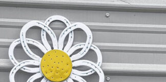 
			
				                                Jarrod High, the May Artist of the Month, crafts welded flowers from horseshoes.
                                 Stephanie Walcott | The Laurinburg Exchange

			
		