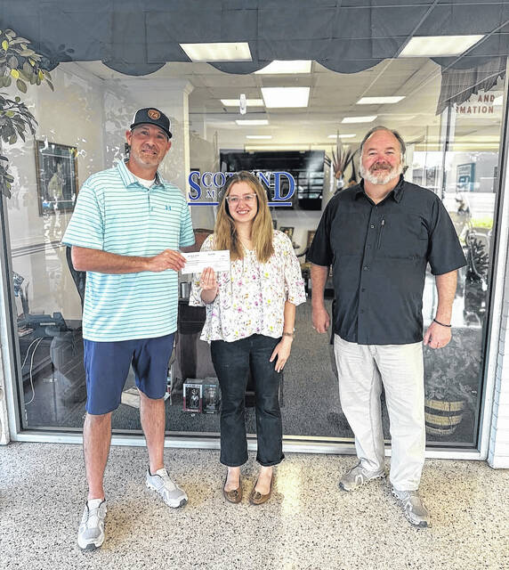 The Laurinburg Highland Hooligans recently announced a jersey sponsorship for their inaugural 2025 season. Here, Billy Norris Jr., Sydney Howell and Lee Howell get together for a picture. 
                                 Courtesy Photo