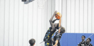 
			
				                                Star Alert player blocking Team Unified at the basket during the SWAT Classic.
                                 Travis Petty Jr | The Laurinburg Exchange

			
		