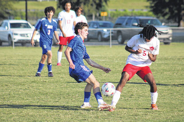 131730231_web1_IMG_9964
Senior Elijah Clark (6) of the Fighting Scots battles for possession against Seventy-First during a heated midfield clash, while teammate Nathan Ward (3) looks on during the first half.
Travis Petty Jr | The Laurinburg Exchange