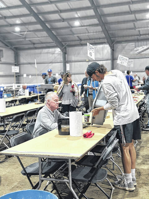131771751_web1_Oyster-1
Guests crack open oysters during last years Chamber on the Half Shell, an annual fundraiser for the Laurinburg/Scotland County Area Chamber of Commerce.
File photo | The Laurinburg Exchange