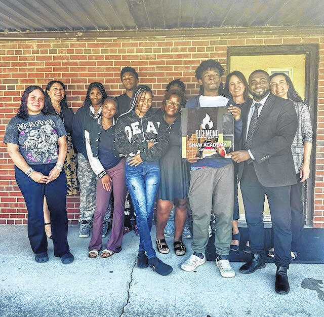 131779181_web1_Shaw-Academy1
Shown are Kesha Hood, director of high schools for Scotland County Schools and Joshua Williams, Shaw Academy principal, with the students at Shaw Academy who are taking classes with Richmond Community College this semester.
Courtesy photo | Via Shaw Academy