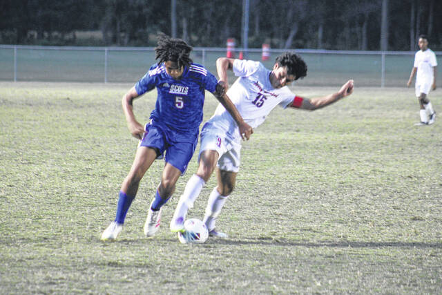 131808969_web1_IMG_1063
Junior Ade Horne (5) of the Scots battles for possession against a Terry Sanford defender during a high-intensity matchup.
Travis Petty Jr | The Laurinburg Exchange